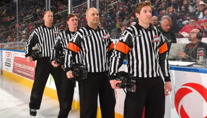 officials umpire in hockey
